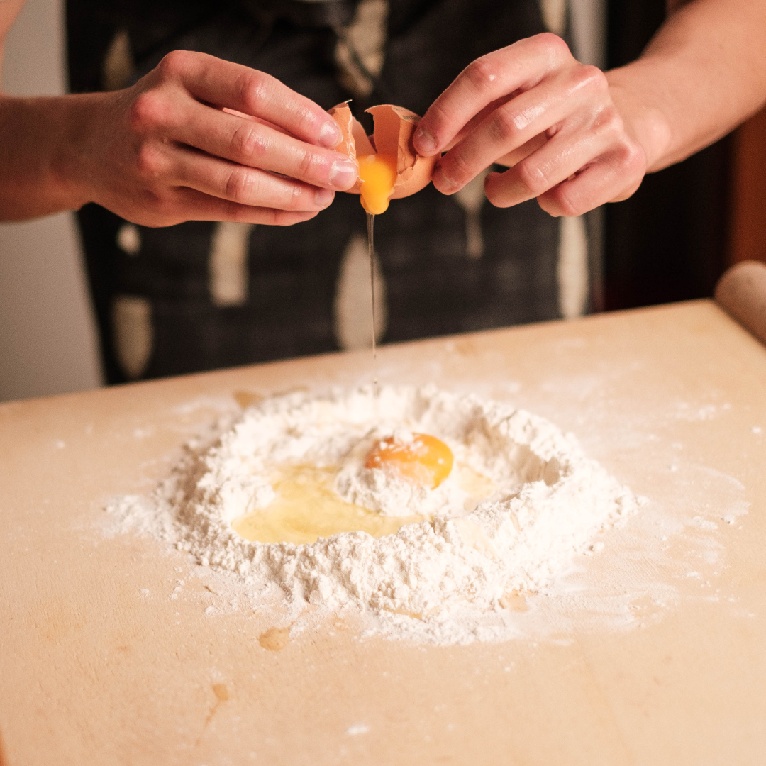 hands with flour and egg